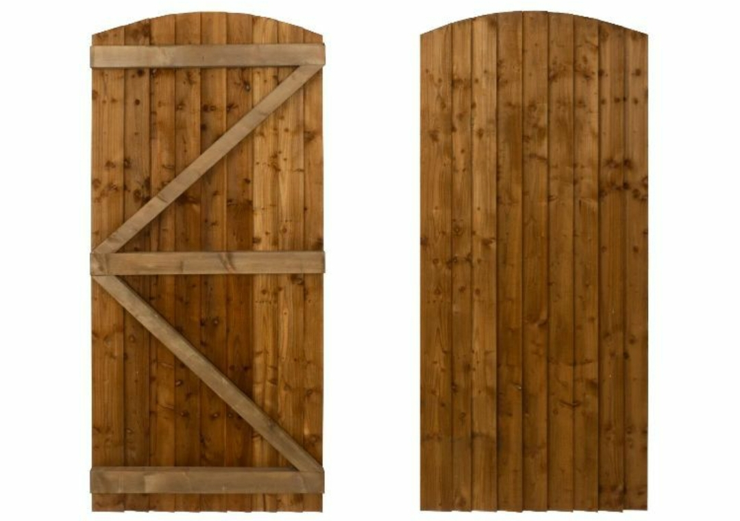 Arched feather edge wooden garden gates made with pressure-treated timber, showing front and back view with ledge and brace design.