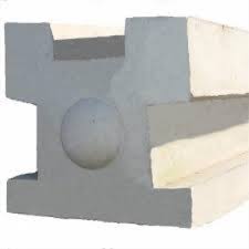 Concrete 3-way fence post with slotted grooves for supporting timber fencing.